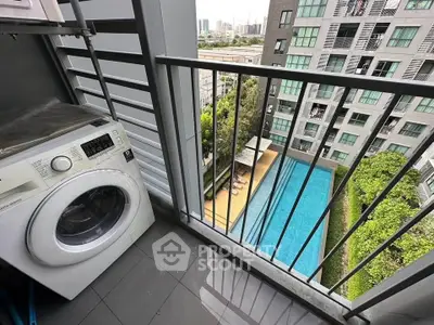 Modern apartment balcony with washing machine and pool view, perfect for urban living.