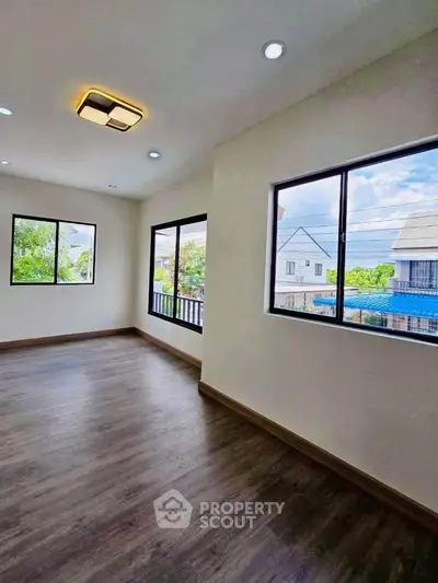 Spacious corner unit with large windows offering abundant natural light and scenic views.