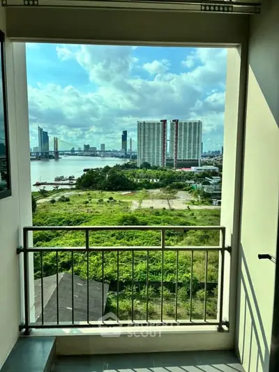 Stunning balcony view of city skyline and river, perfect for urban living enthusiasts.