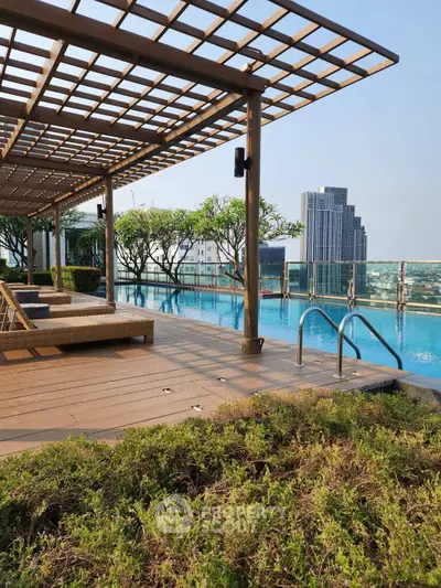 Luxurious rooftop pool with stunning city views and elegant lounging area.