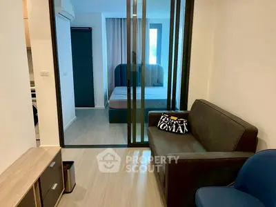 Modern apartment with glass partition and cozy furnishings