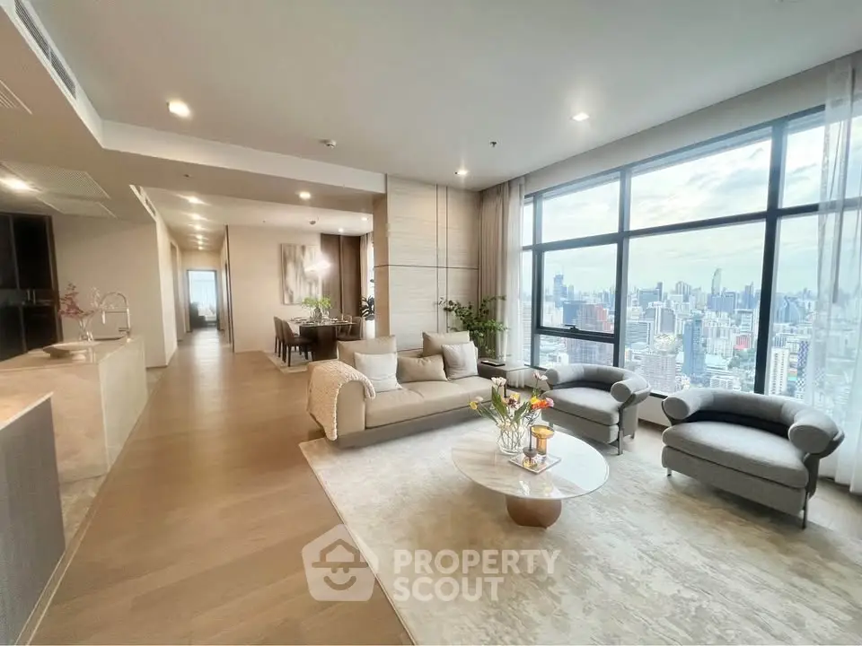 Luxurious high-rise living room with stunning city view and elegant modern decor.