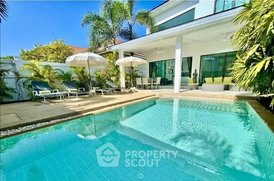 Luxurious villa with private pool and lush garden, perfect for relaxation and entertaining.