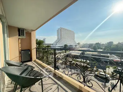 Spacious balcony with stunning city view and modern railing design.