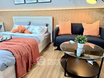 Modern bedroom with stylish decor and cozy seating area