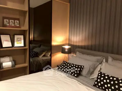 Cozy bedroom with stylish decor and ambient lighting, featuring a comfortable bed and modern shelving.