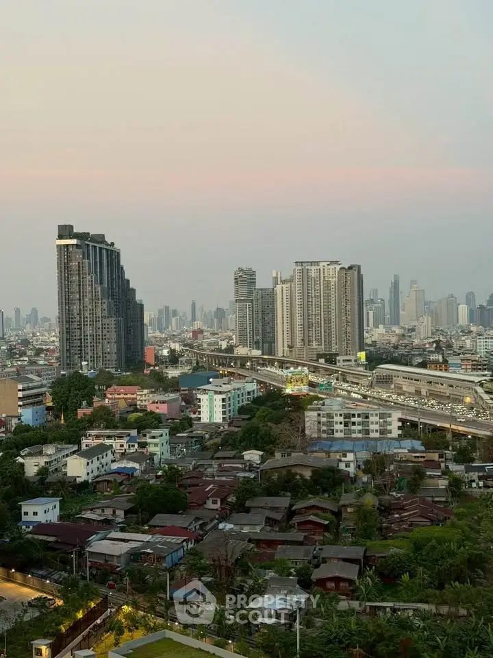 Stunning cityscape view showcasing modern high-rise buildings and vibrant urban landscape at sunset.