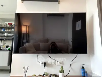 Modern living room with wall-mounted TV and stylish decor