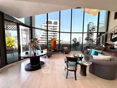 Luxurious living room with floor-to-ceiling windows and stunning city views