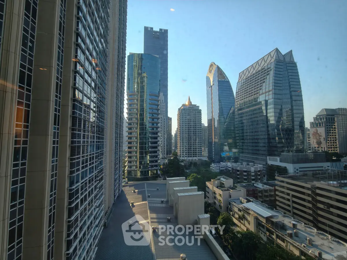 Stunning cityscape view from a high-rise building showcasing modern architecture and urban skyline.