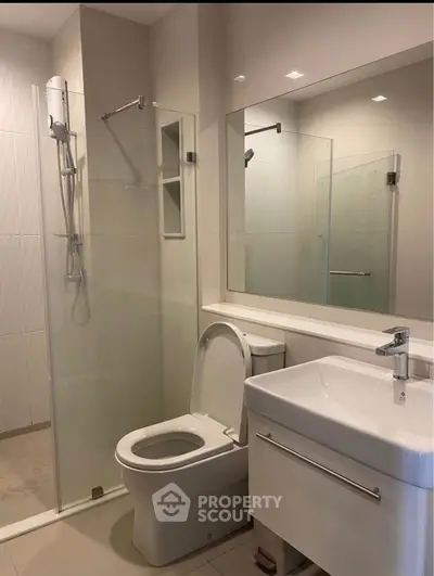 Modern bathroom with glass shower and sleek fixtures