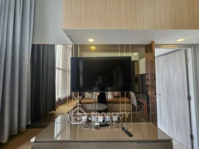 Luxurious living room with modern TV setup and elegant decor