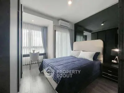 Modern bedroom with stylish decor and natural light in a contemporary apartment.