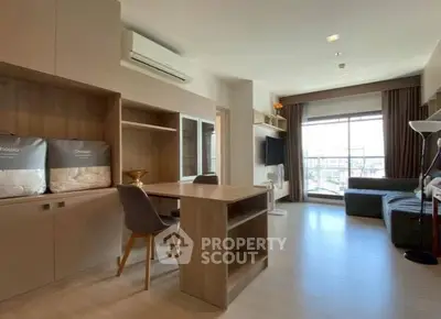 Spacious modern living room with large window and stylish furniture in a high-rise apartment.