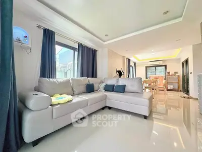 Spacious modern living room with elegant corner sofa and dining area