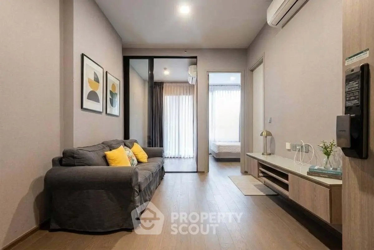 Modern living room with cozy sofa and stylish decor in a contemporary apartment.