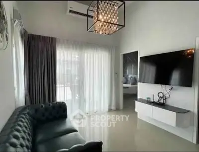 Modern living room with sleek TV setup and elegant lighting