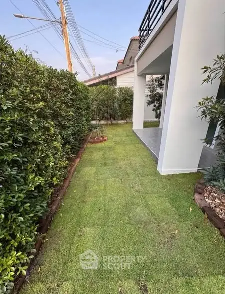 Charming garden view with lush greenery and modern exterior design