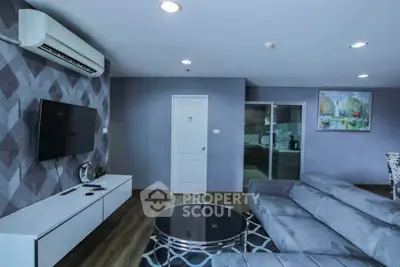 Modern living room with stylish decor and air conditioning in a contemporary apartment.