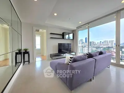 Modern living room with city view and sleek furniture
