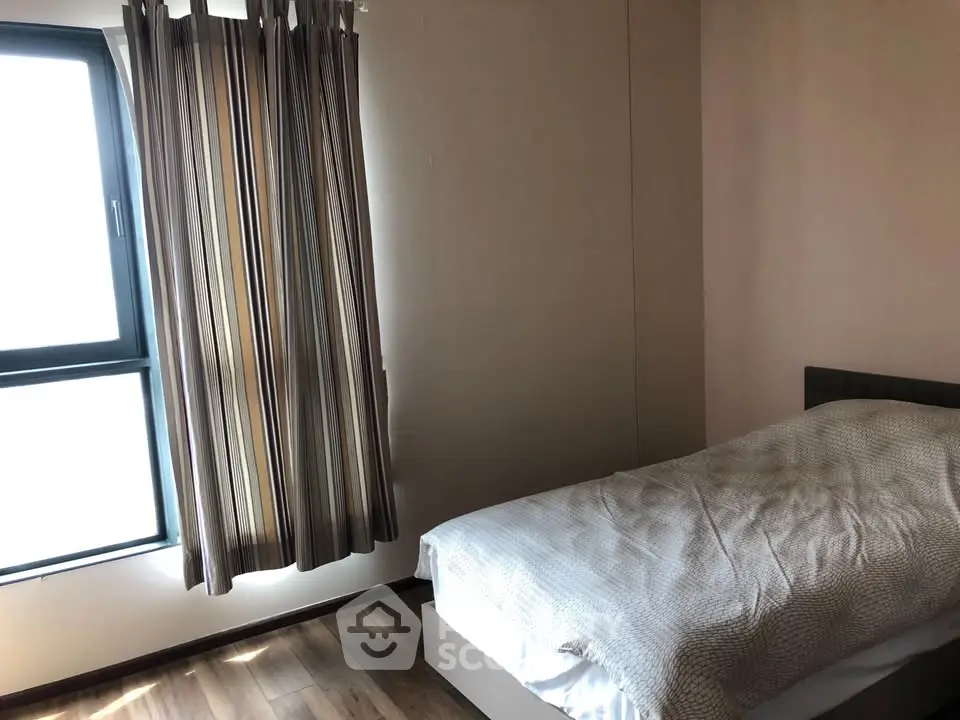 Cozy bedroom with natural light and modern decor