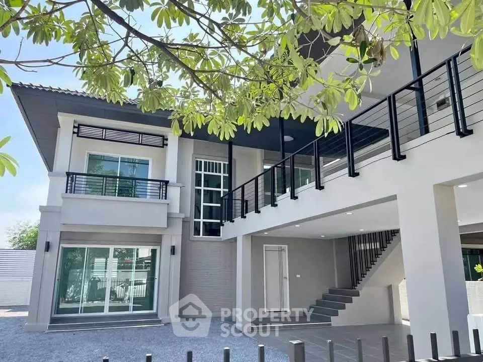 Modern two-story house with sleek design and spacious balcony