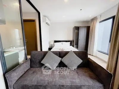 Modern studio apartment with cozy living area and stylish bedroom