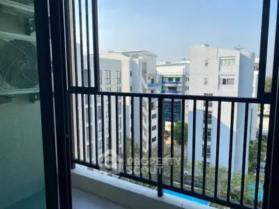 Modern apartment balcony with city view and pool below