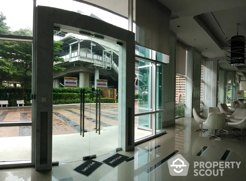 Modern building entrance with glass doors and stylish interior design