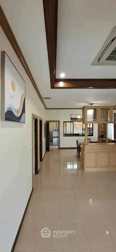 Spacious open layout kitchen with modern design and ample natural light.