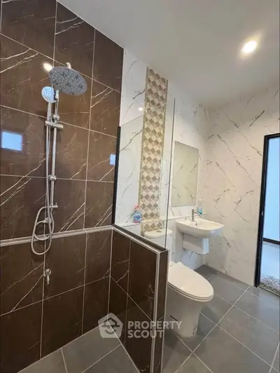 Modern bathroom with elegant marble tiles and sleek fixtures