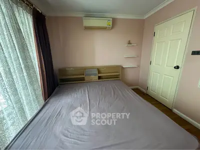 Cozy bedroom with air conditioning and natural light