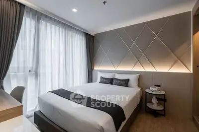 Modern bedroom with stylish decor and natural light