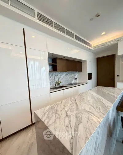 Luxurious modern kitchen with marble countertops and sleek cabinetry