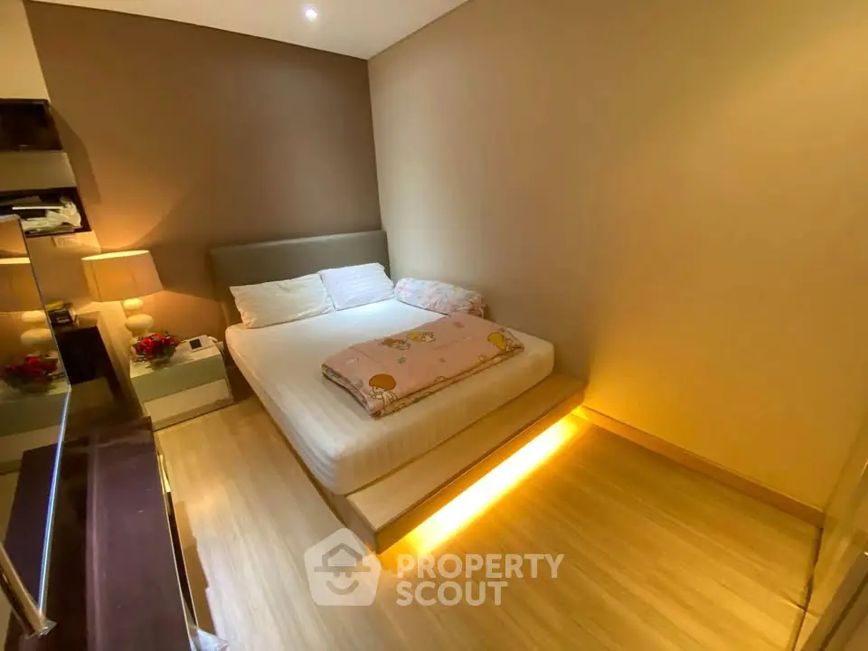Cozy bedroom with modern lighting and elegant decor