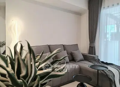 Modern living room with gray sofa and stylish decor
