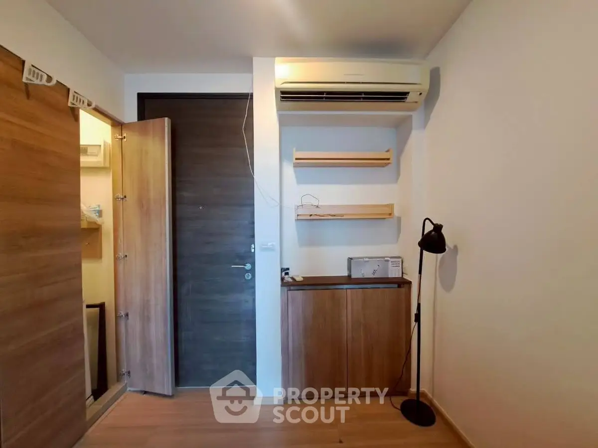 Compact modern room with wooden accents and air conditioning