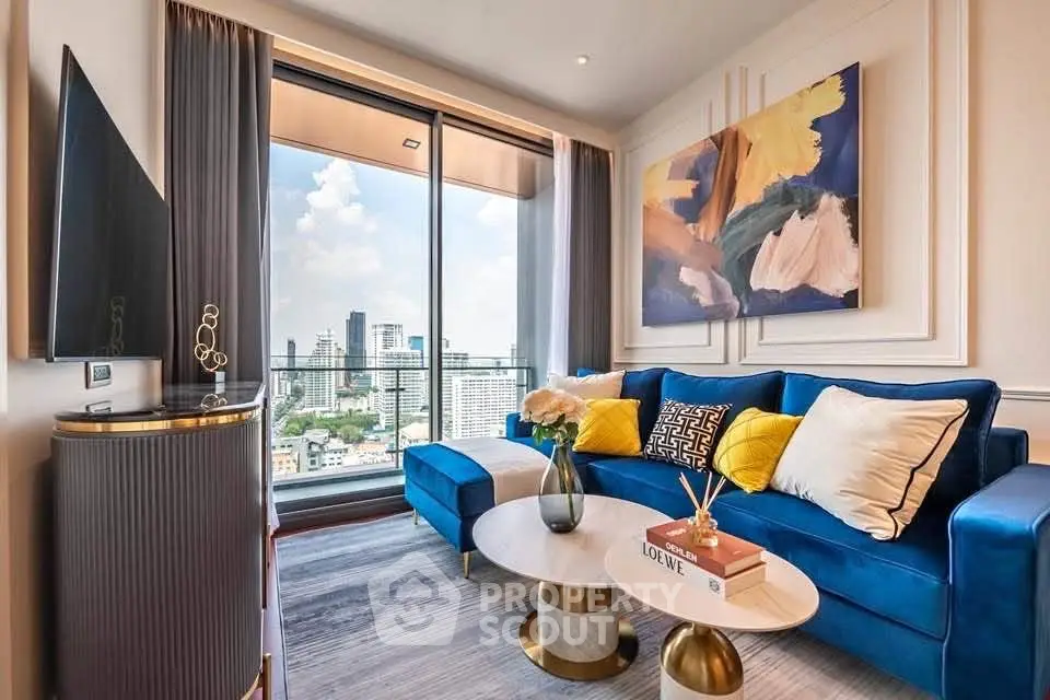 Luxurious living room with stunning city view, modern decor, and vibrant blue sofa in high-rise apartment.