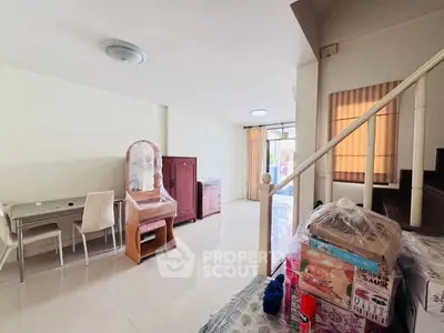 Spacious living area with modern furniture and natural light