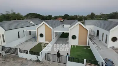 Modern suburban homes with unique circular windows and spacious yards