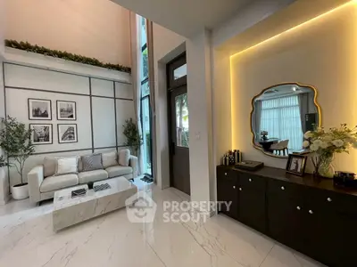 Luxurious modern living room with high ceilings and elegant decor