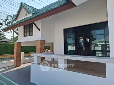 Charming suburban home with spacious porch and modern design, perfect for family living.
