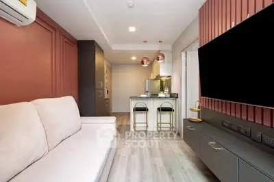 Modern living room with stylish decor and open kitchen layout
