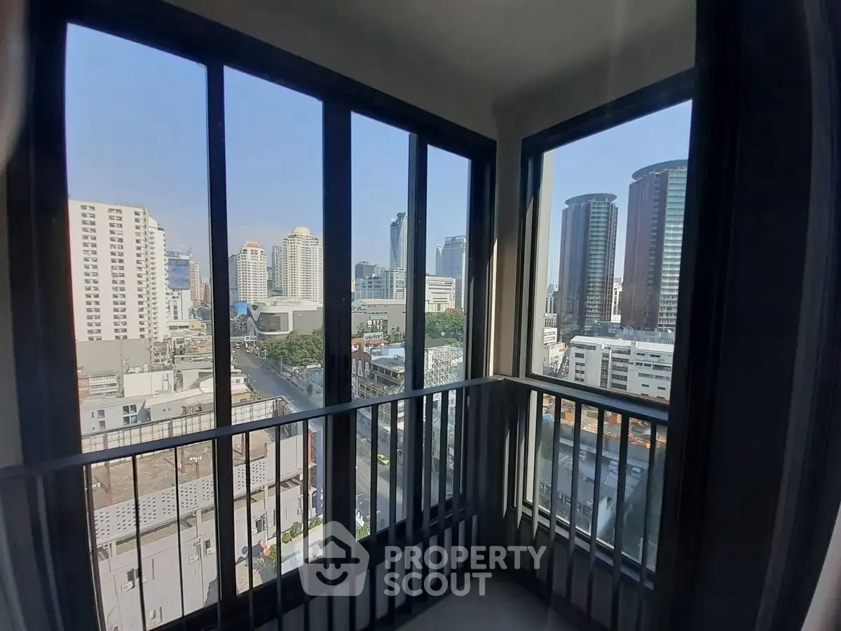 Stunning city view from a modern high-rise balcony, perfect for urban living.