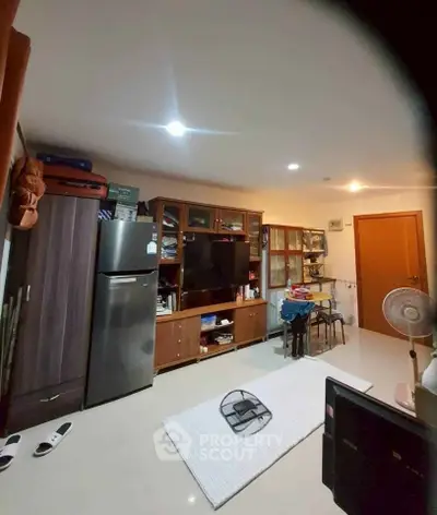 Cozy living room with modern appliances and ample storage space