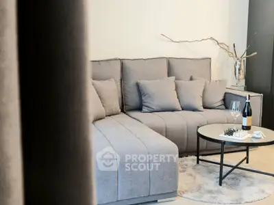 Stylish modern living room with gray sofa and chic decor