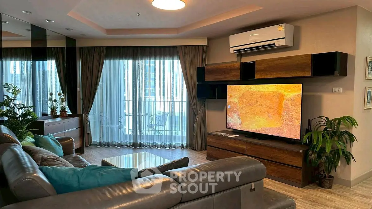 Luxurious living room with modern decor and balcony view