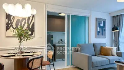 Modern living room with stylish decor and open kitchen layout