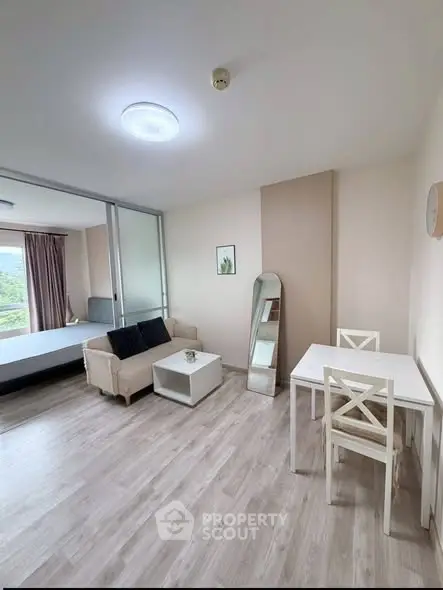 Modern studio apartment with open layout and stylish furnishings