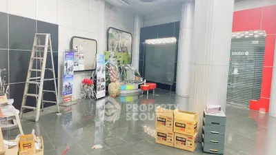 Spacious commercial space with modern design and glossy flooring, ideal for retail or office setup.